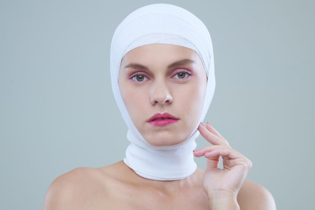 serious woman in head bandage